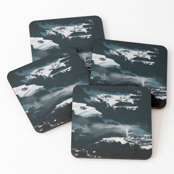 Item preview, Aerial view of alpine ski village nestled in snowy mountains with morning fog and dramatic winter atmosphere designed and sold by VasilisLens.