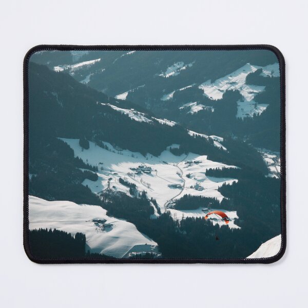 Item preview, Paraglider soaring over dramatic alpine mountain landscape with snow-covered slopes and valley below designed and sold by VasilisLens.