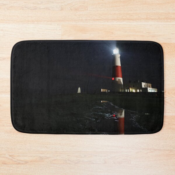 Item preview, Portland Bill Lighthouse Relected in a Puddle at Night designed and sold by Aham Photos.