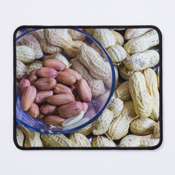 Item preview, Assorted Peanuts In Shell And Peanuts In A Glass Bowl On Wooden Table designed and sold by Nmallia.