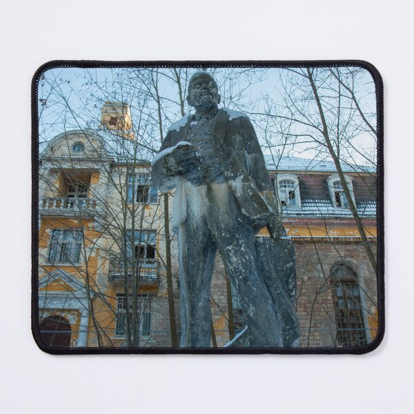 Item preview, Abandoned Lenin statue in front of a dilapidated sanatorium in winter – Lost Place Urbex Photography designed and sold by MarkusUrbex.