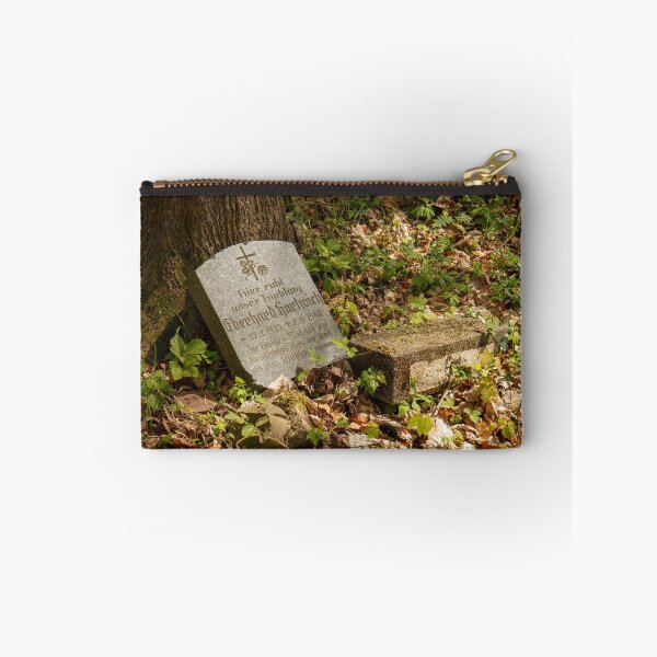 Item preview, Weathered gravestone in the woods – old cemetery & forgotten memory | Photographic art designed and sold by MarkusUrbex.