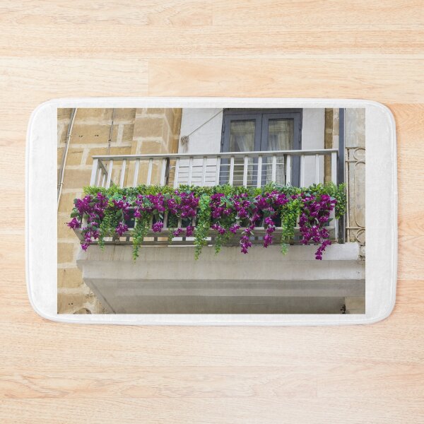Item preview, Purple Flower Balcony Planter With Green Vines Over Wooden Railing On Stone Building designed and sold by Nmallia.