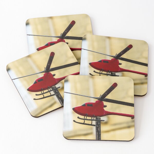 Item preview, Red Model Helicopter Weather Vane On Post With Blurred Urban Background In Sunlit City designed and sold by Nmallia.