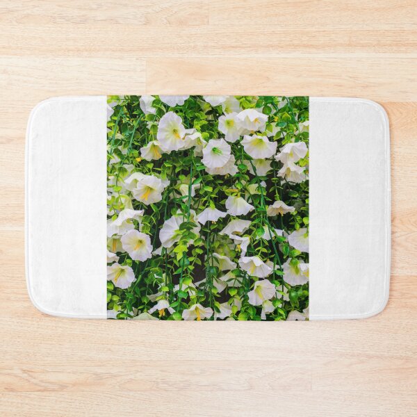 Item preview, White Morning Glory Flowers in Green Vines Cascading Over a Lush Garden Fence designed and sold by Nmallia.