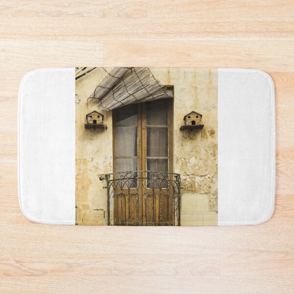 Item preview, Weathered Balcony Door With Rustic Iron Railing And Birdhouses On Cracked Stone Wall Facade Exterior designed and sold by Nmallia.