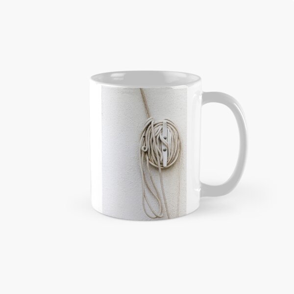 Item preview, Coiled Rope on Wall Hook With Long White Cord on Textured Wall designed and sold by Nmallia.