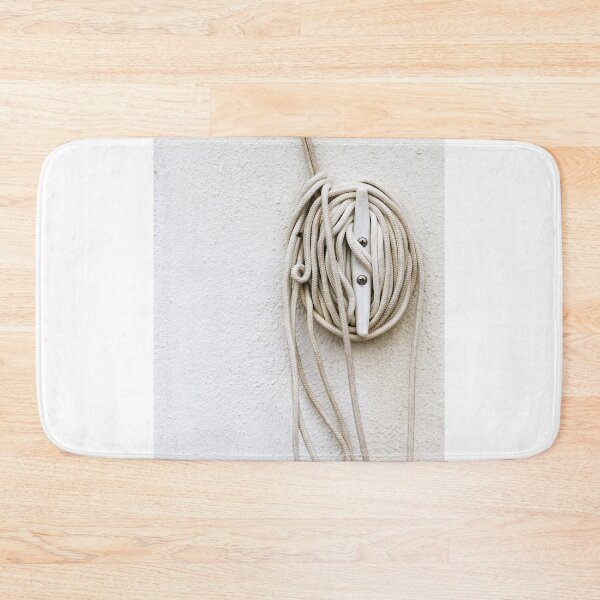 Item preview, Coiled Rope on Wall Hook With Long White Cord on Textured Wall designed and sold by Nmallia.