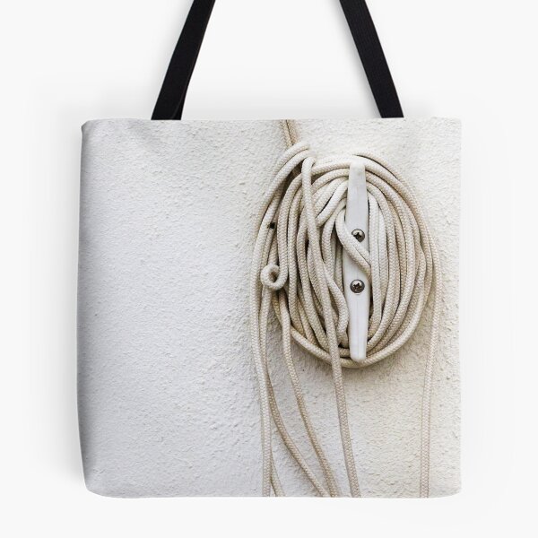Item preview, Coiled Rope on Wall Hook With Long White Cord on Textured Wall designed and sold by Nmallia.