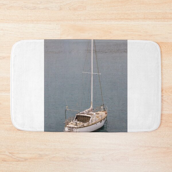 Item preview, Relaxing Sailboat Floating in Calm Harbor With Large Blue Vessel in Background Near Industrial Dock Scenery designed and sold by Nmallia.