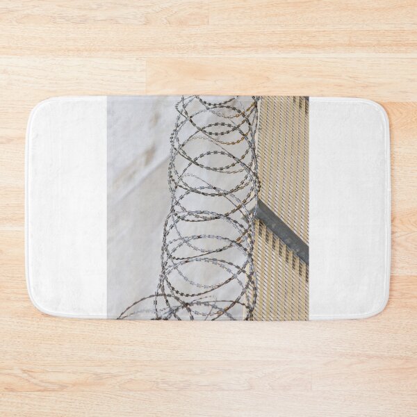 Item preview, Coiled Barbed Wire Fence Ribbons Create Stark Security Barrier Against Intrusion designed and sold by Nmallia.