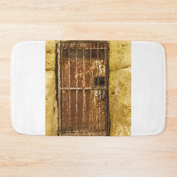 Item preview, Abandoned Doorway In Yellow Wall With Rusted Gate And Debris On The Sidewalk designed and sold by Nmallia.