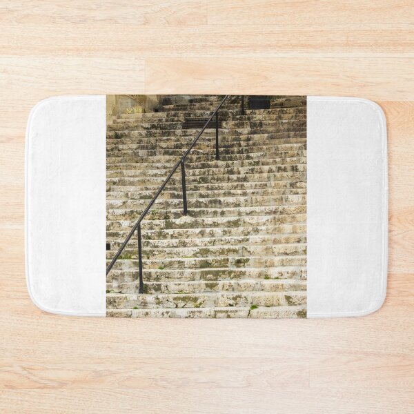 Item preview, Weathered Stone Staircase With Black Railings and Potted Plant in Historic Exterior Town Setting designed and sold by Nmallia.
