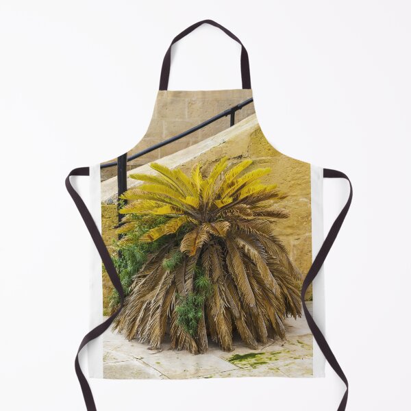 Item preview, Yellow Palm Fronds Grow From A Foliage Bush Beside A Stony Staircase Wall designed and sold by Nmallia.