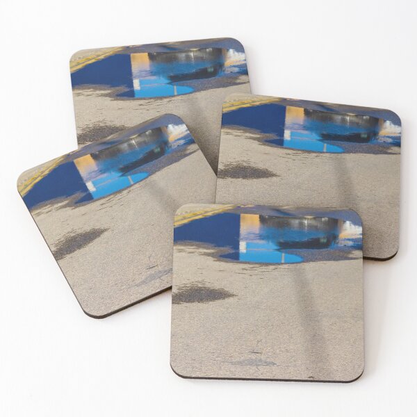Item preview, Puddle On Wet Road Surface Reflects Buildings In Bright Urban Street Scene designed and sold by Nmallia.