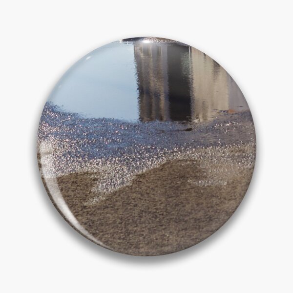 Item preview, Puddle On Wet Road Surface Reflects Buildings In Bright Urban Street Scene designed and sold by Nmallia.