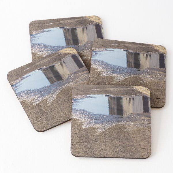 Item preview, Puddle On Wet Road Surface Reflects Buildings In Bright Urban Street Scene designed and sold by Nmallia.