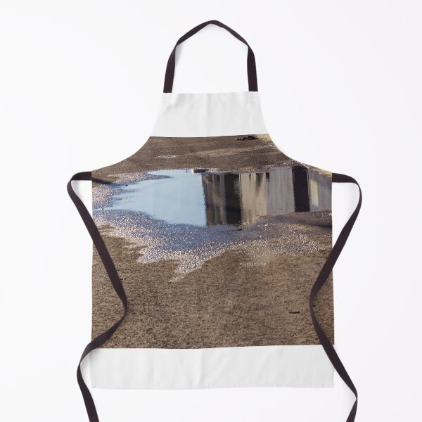 Item preview, Puddle On Wet Road Surface Reflects Buildings In Bright Urban Street Scene designed and sold by Nmallia.