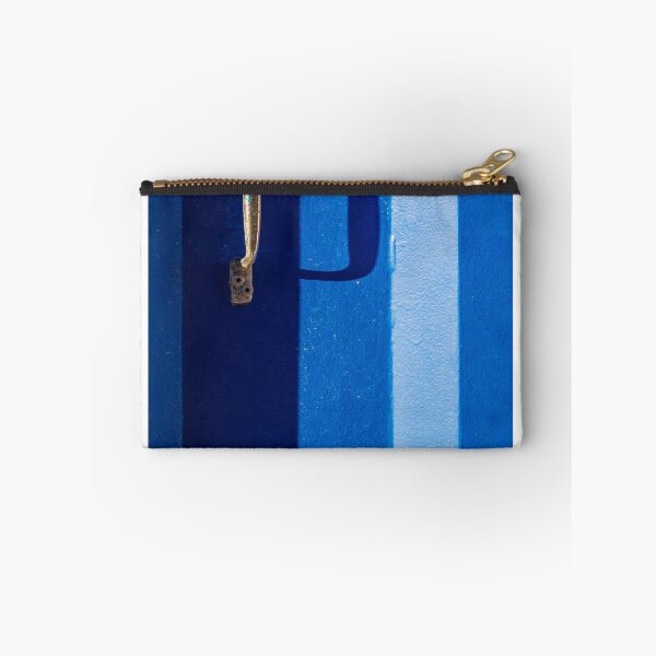 Item preview, Vibrant Blue Door With Rustic Metal Handle And Dramatic Shadow On Bright Wall designed and sold by Nmallia.