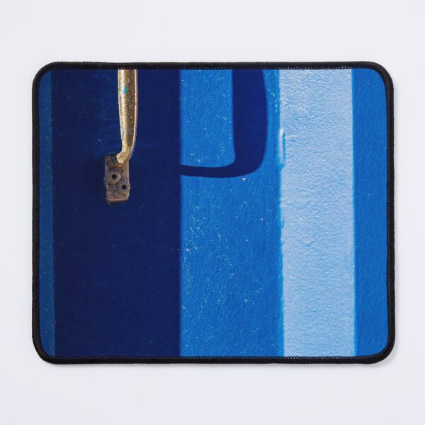 Item preview, Vibrant Blue Door With Rustic Metal Handle And Dramatic Shadow On Bright Wall designed and sold by Nmallia.