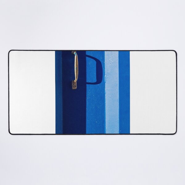 Item preview, Vibrant Blue Door With Rustic Metal Handle And Dramatic Shadow On Bright Wall designed and sold by Nmallia.