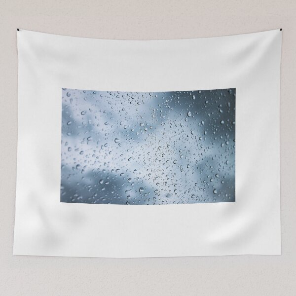 Item preview, Close-up of rain droplets with dramatic storm clouds in the background designed and sold by grande76.