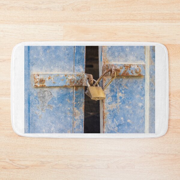 Item preview, Rusty Blue Door With Padlock and Locking Bar in Abandoned, Weathered Building Entrance designed and sold by Nmallia.