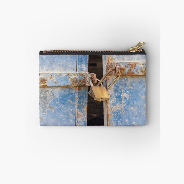 Item preview, Rusty Blue Door With Padlock and Locking Bar in Abandoned, Weathered Building Entrance designed and sold by Nmallia.