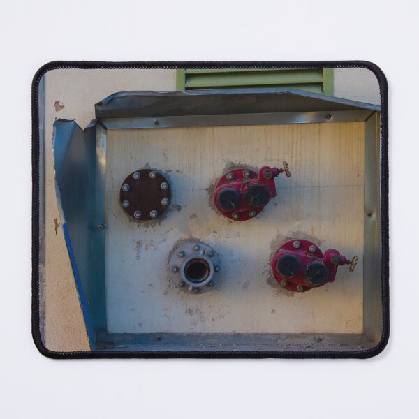Item preview, Industrial Wall-Mounted Valve Box With Red Handles And Weathered Metal Surface Outdoors designed and sold by Nmallia.
