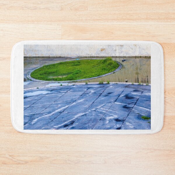 Item preview, Abandoned Parking Lot With Circular Green Island And Wet Paved Surface For Stock Use designed and sold by Nmallia.
