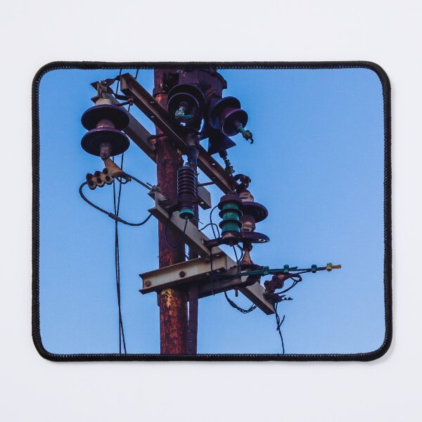 Item preview, Rusty Electrical Power Pole With Insulators Against Clear Blue Sky at Sunset designed and sold by Nmallia.