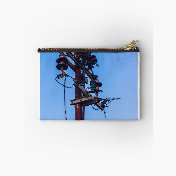 Item preview, Rusty Electrical Power Pole With Insulators Against Clear Blue Sky at Sunset designed and sold by Nmallia.