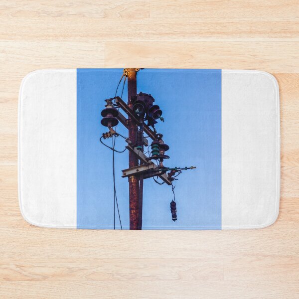 Item preview, Rusty Electrical Power Pole With Insulators Against Clear Blue Sky at Sunset designed and sold by Nmallia.
