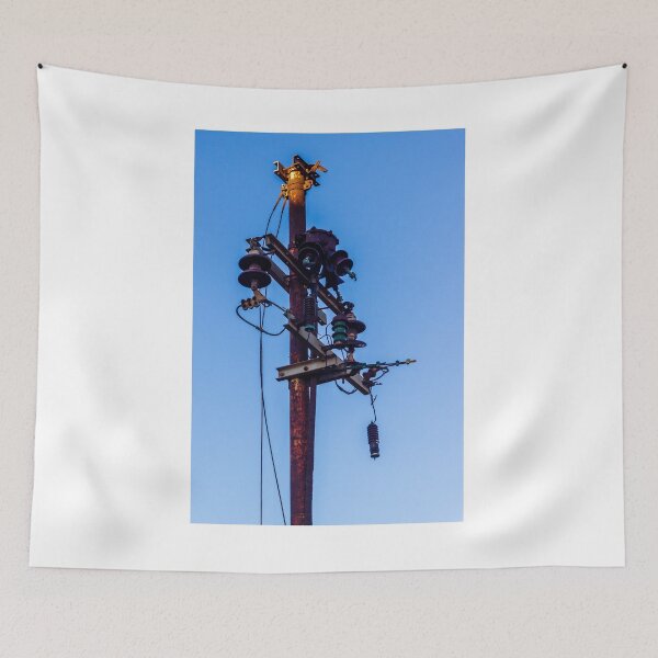 Item preview, Rusty Electrical Power Pole With Insulators Against Clear Blue Sky at Sunset designed and sold by Nmallia.