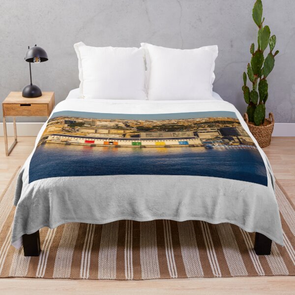 Item preview, Colorful Waterfront Warehouse Doors Along Harbor With City Skyline At Sunset designed and sold by Nmallia.
