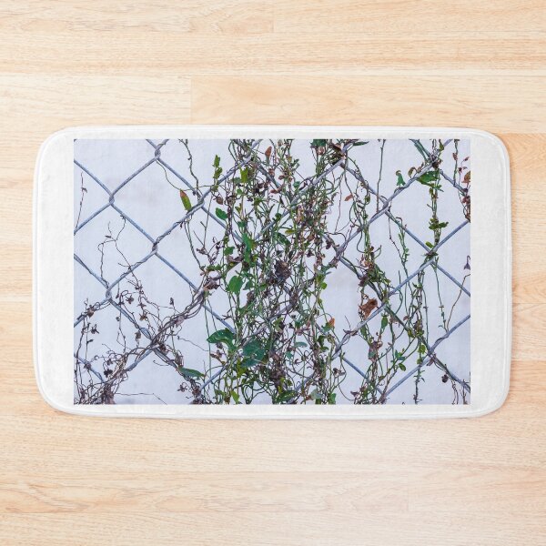 Item preview, Vines Climbing A Chain Link Fence In An Urban Setting With Dried Leaves designed and sold by Nmallia.