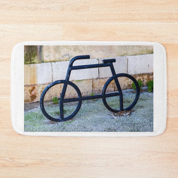 Item preview, Minimalist Black Metal Bicycle Sculpture Resting Against a Stone Wall in an Outdoor Space designed and sold by Nmallia.