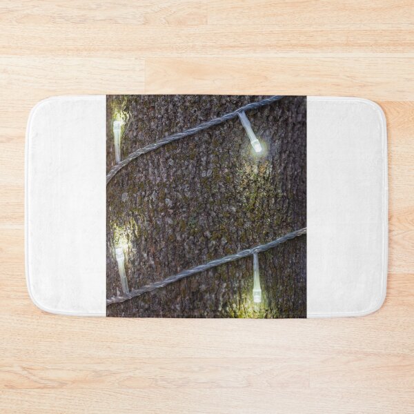 Item preview, Warm String Lights Cast Cozy Glow Across Rough Stone Wall For Rustic Festive Ambience designed and sold by Nmallia.