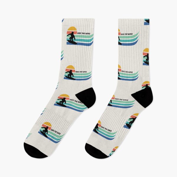 Item preview, Surfer silhouette riding a wave with a stylized sunset and Ride the Wave text designed and sold by AtonuHaque.