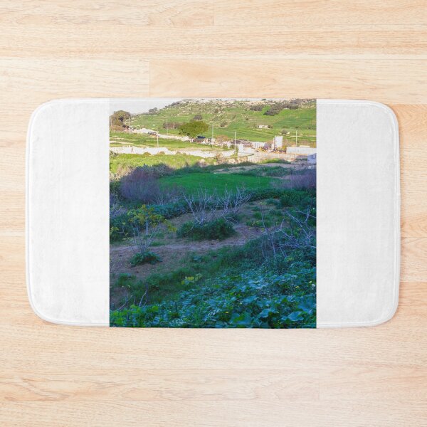 Item preview, Scenic Bright Sunlit Green Hills Over Rural Fields with Construction Site and Leafy Foreground Vista designed and sold by Nmallia.