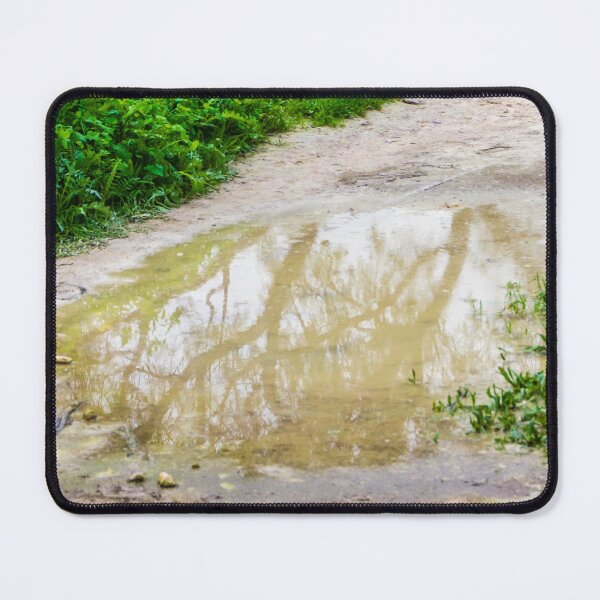 Item preview, Muddy Path With Puddle Reflection Along Lush Green Grass and Wildflowers designed and sold by Nmallia.