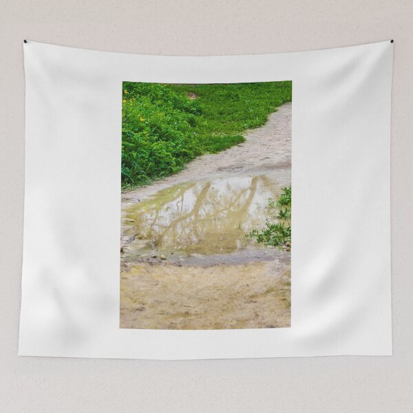 Item preview, Muddy Path With Puddle Reflection Along Lush Green Grass and Wildflowers designed and sold by Nmallia.
