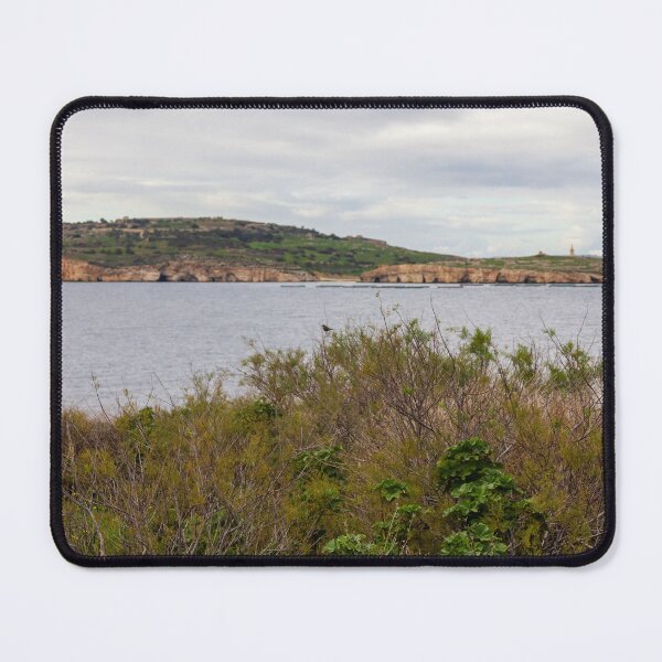 Item preview, Coastal Landscape With Calm Water, Distant Hills, And Lush Green Shoreline Bushes designed and sold by Nmallia.