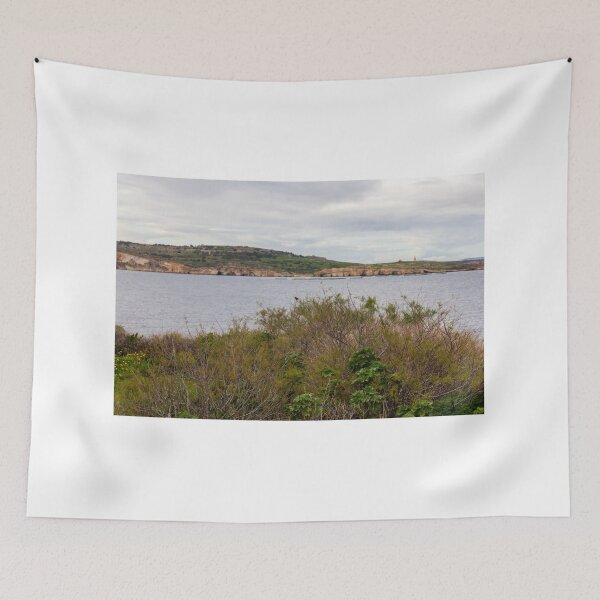 Item preview, Coastal Landscape With Calm Water, Distant Hills, And Lush Green Shoreline Bushes designed and sold by Nmallia.
