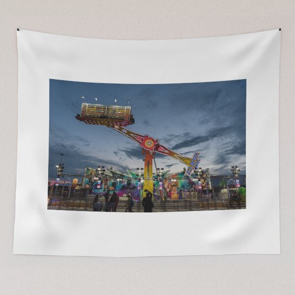 Item preview, Carousel with many lights turns fast in front of steady spectators designed and sold by brambillasimone.