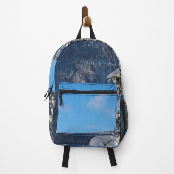 Item preview, Snow Covered Pine Tree Against Blue Sky designed and sold by MatthewHeights.