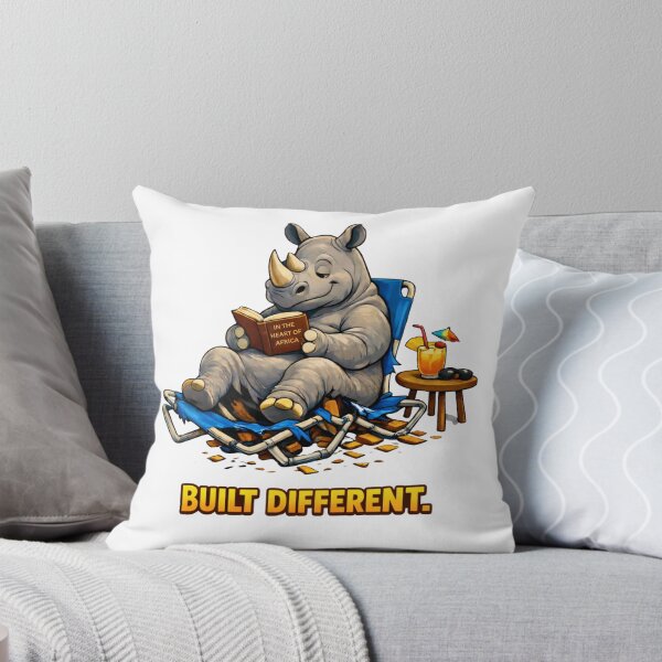 Item preview, Built Different – Relaxed Rhino Poolside Reading Funny Animal T-Shirt designed and sold by AnimalMarvels.
