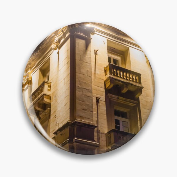 Item preview, Illuminated Historic Building Facade With Balconies And Ornate Architecture At Night On Street designed and sold by Nmallia.