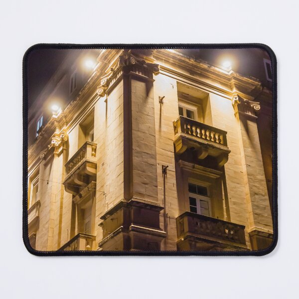 Item preview, Illuminated Historic Building Facade With Balconies And Ornate Architecture At Night On Street designed and sold by Nmallia.