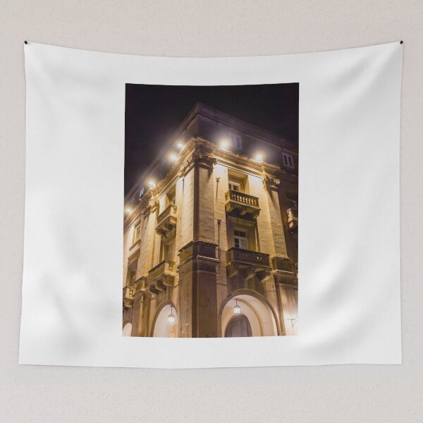 Item preview, Illuminated Historic Building Facade With Balconies And Ornate Architecture At Night On Street designed and sold by Nmallia.